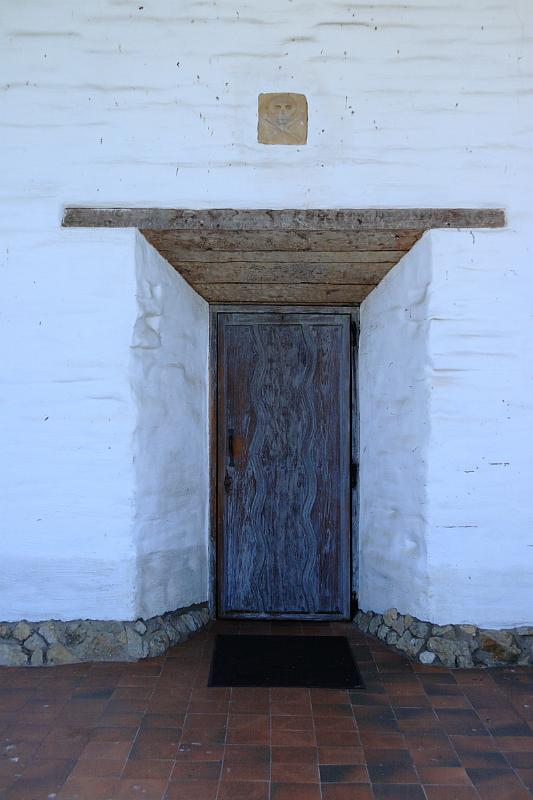 sonoma15.JPG - The walls are about 4 feet thick.  Above the door is a skull and cross bones indicating the cemetery.
